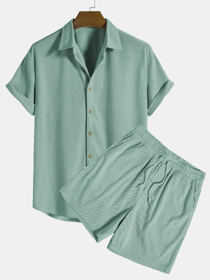 Casual men's polyester shorts with stripes, matching a summer shirt. Great for vacation & beachwear.