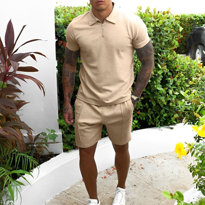 Stylish men's summer loungewear set featuring a short-sleeved polo and comfortable shorts, breathable material.