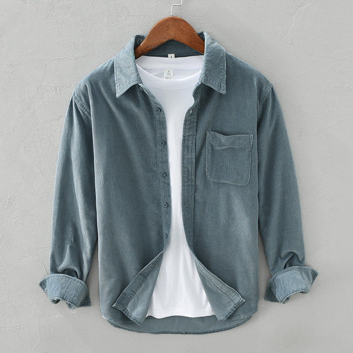 Versatile men's textured button-up shirt, long sleeves & chest pocket. Ideal for casual or layering outfits.