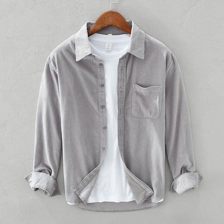 Stylish men's long sleeve button-up shirt featuring a unique texture and practical chest pocket.