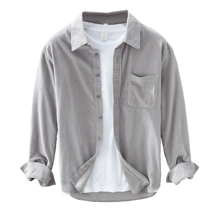 Classic men's textured button-up shirt with long sleeves and a chest pocket, great for layering.