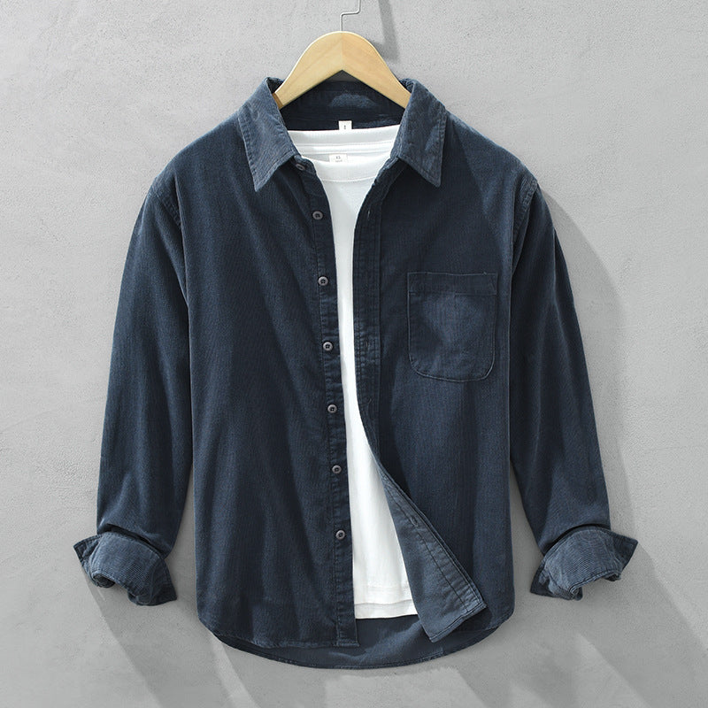Comfortable men's casual shirt: textured fabric, long sleeves, button-up design & chest pocket.