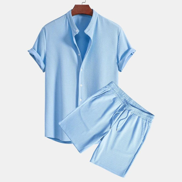 Men's casual two-piece polo set with mandarin collar and ribbed knit, perfect for summer comfort.