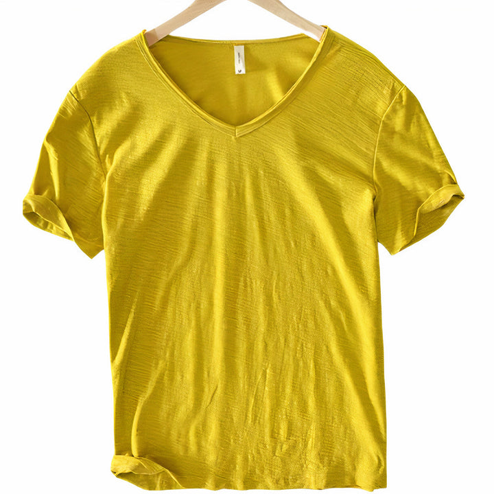 Model wearing a white men's v-neck casual t-shirt, showcasing a lightweight apparel.