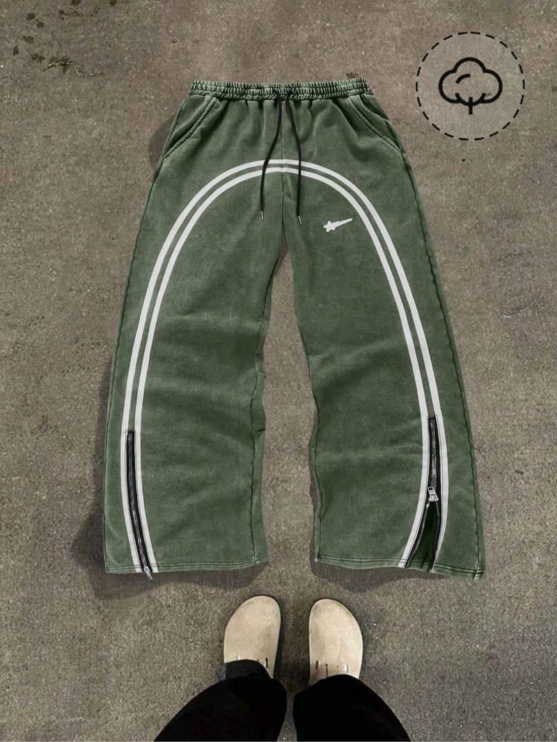 Comfortable men's athletic track pants, Catania style, with functional zip hems.