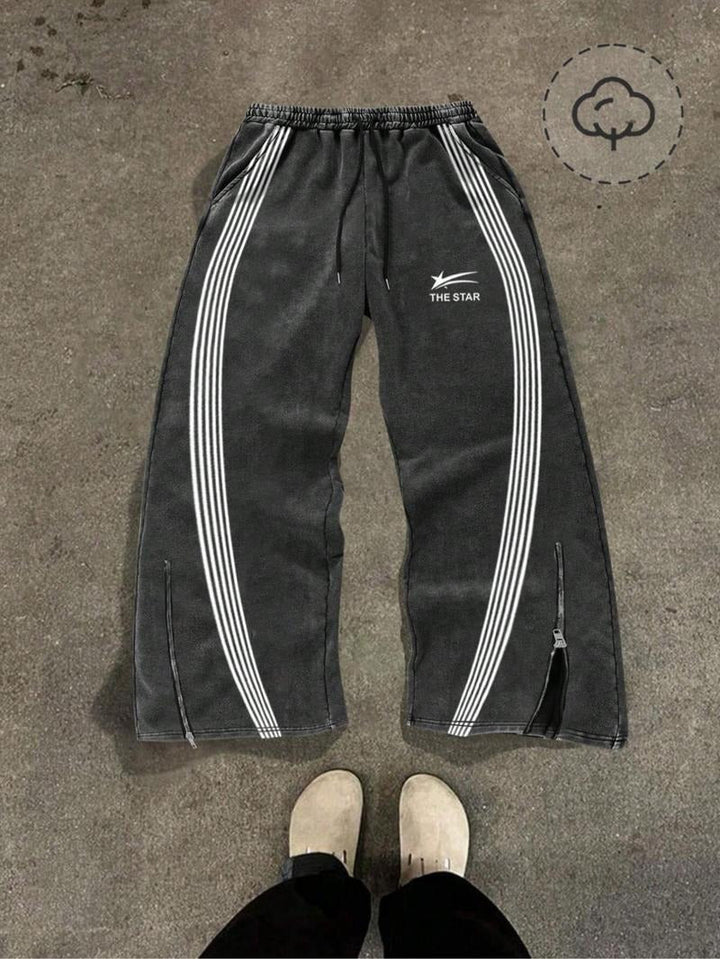 Men's performance track pants, Catania design, with flexible fit & zip hems for sports.
