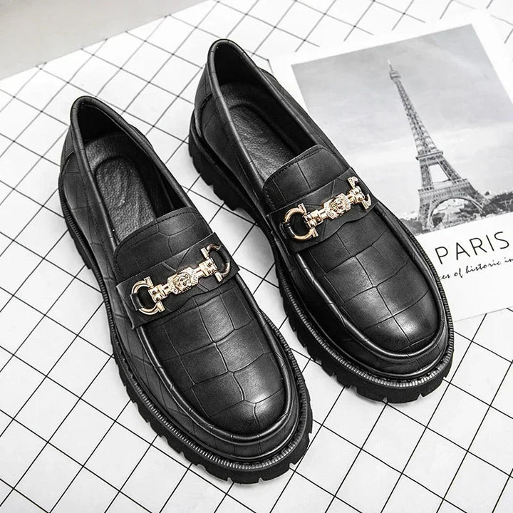 Sophisticated men's chain loafer. Black leather dress shoe with a modern lug sole for bold, contemporary style.