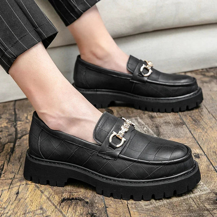 Rugged yet refined men's chain loafers. Premium leather footwear with a prominent chain and a durable lug sole.