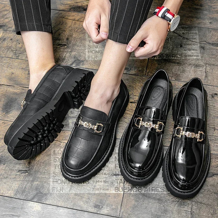 Close-up of a men's Cavalier chain loafer, showcasing the bold chain detail, sleek upper, and robust lug sole.