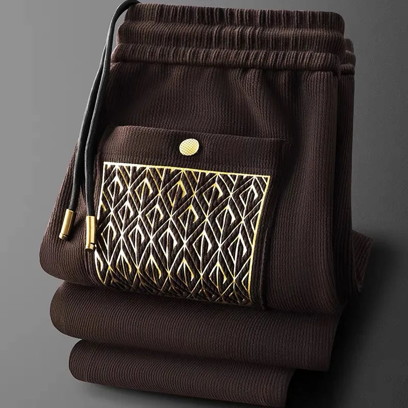 Modern fit men's Cavo pants, ideal for streetwear, enhanced with sophisticated gold details.