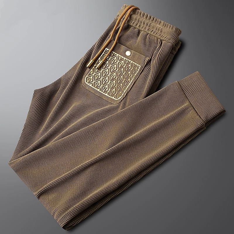 Gold-detailed men's Cavo trousers, offering both luxury fashion and casual wear comfort.
