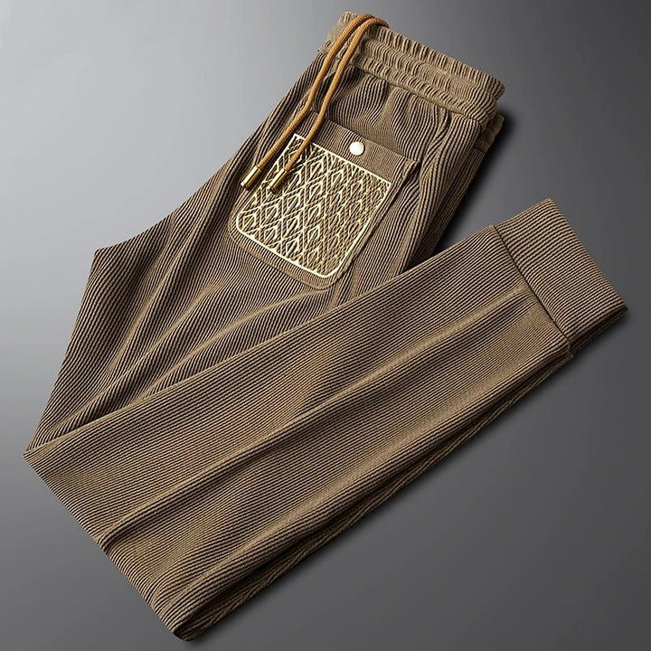 Gold-detailed men's Cavo trousers, offering both luxury fashion and casual wear comfort.