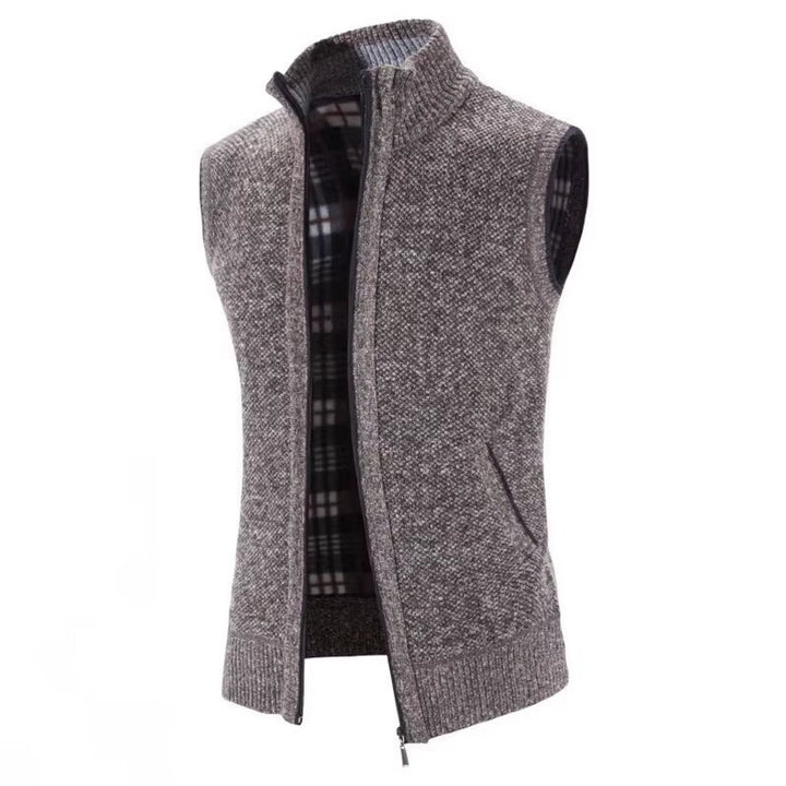 Men's comfortable gray wool vest, full-zip front, revealing a unique plaid pattern lining. Ideal outerwear.