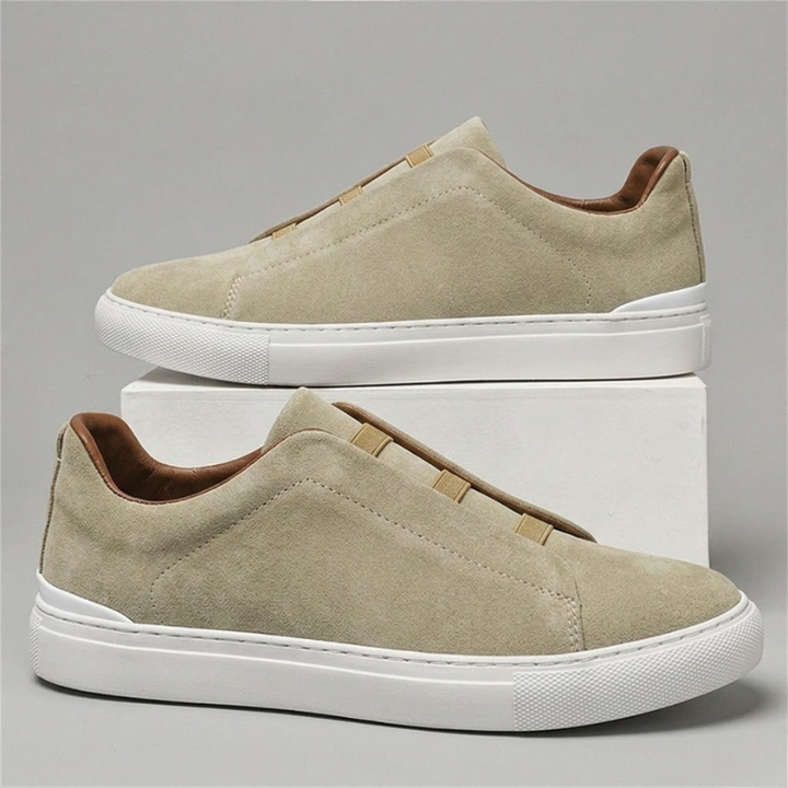 Black men's Chelsea sneakers, slip-on style. Versatile, comfortable, and stylish for casual & everyday wear.