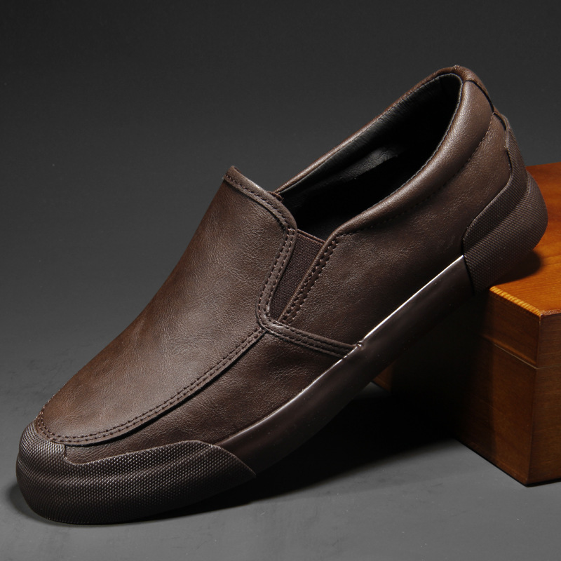 Gray & black men's slip-on Chelsea sneakers. Comfortable, casual footwear for modern men's fashion.