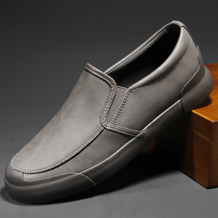 Versatile men's Chelsea style slip-on sneakers in tan, brown, gray, black, & red for casual fashion.