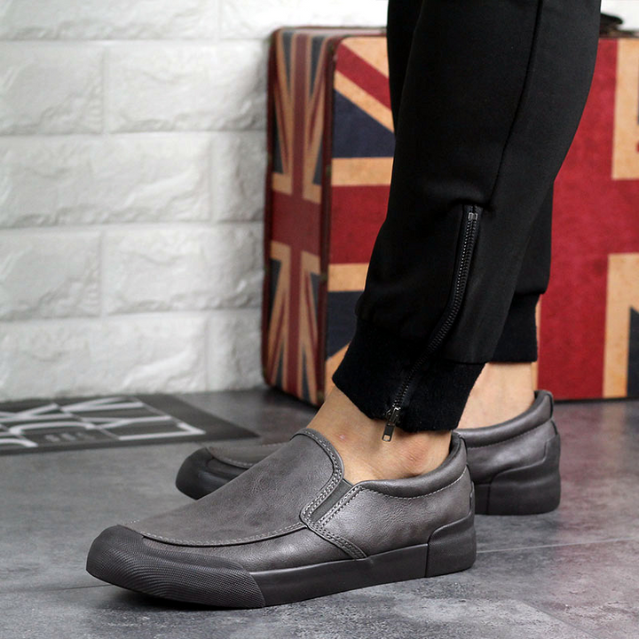 Red men's Chelsea style slip-on sneakers. Fashionable, comfortable casual footwear for daily wear.