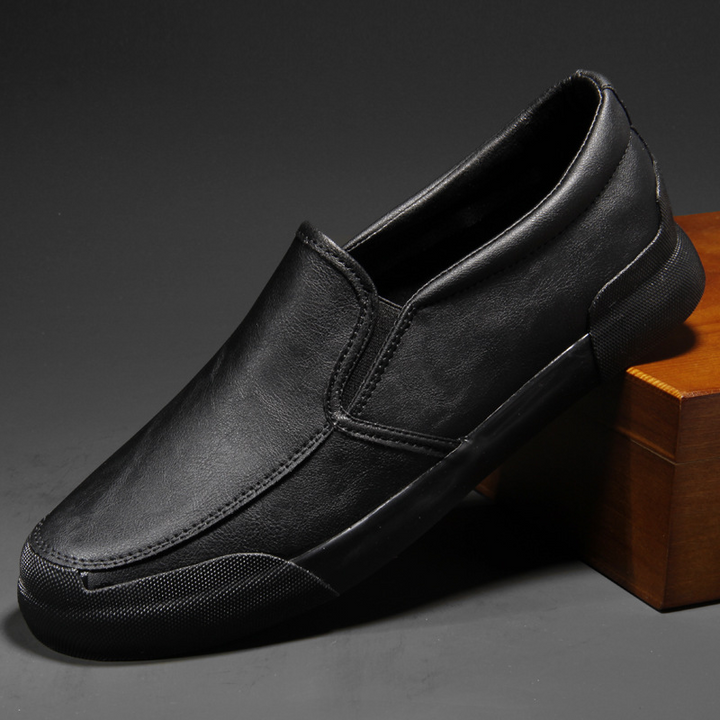 Brown men's Chelsea style slip-on sneakers. Modern, comfortable casual shoes for men's everyday fashion.