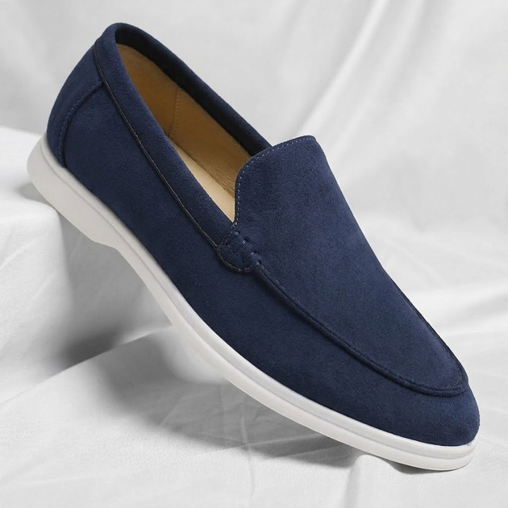 Side view of tan leather Chester loafers for men, featuring a comfortable sole.