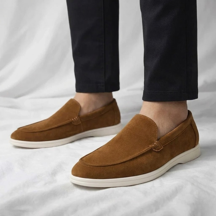 Full view of comfortable black slip-on dress shoes, Men's Chester loafers.