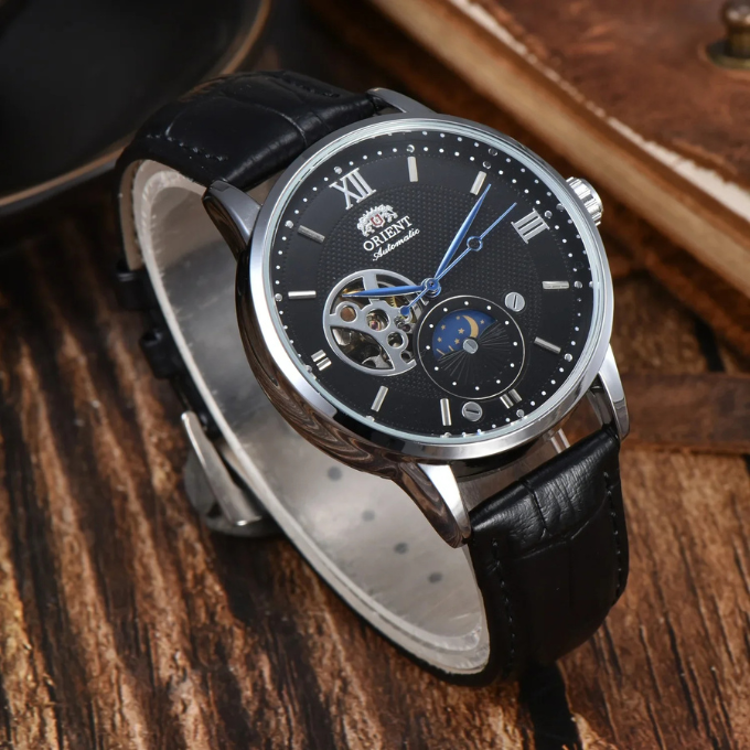 Classic men's luxury automatic watch, sun & moon display, rich leather strap, vintage mechanical timepiece.