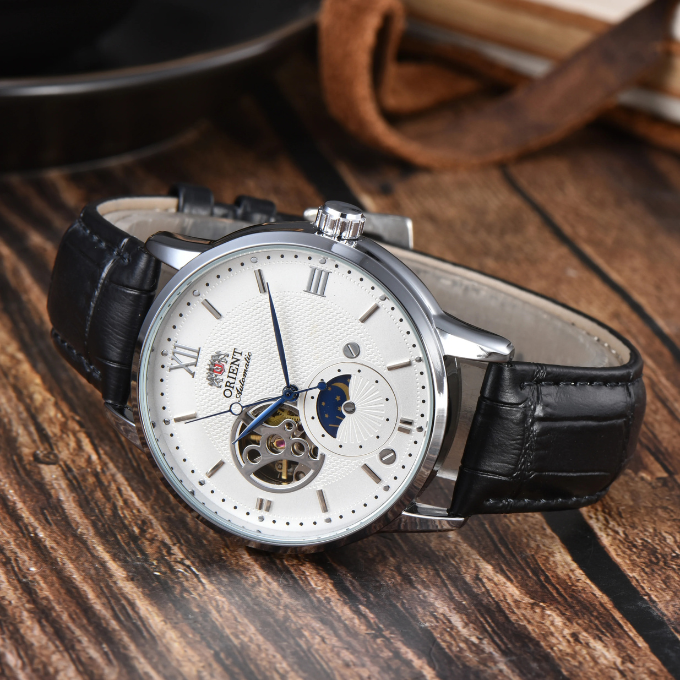High-angle shot of a men's automatic sun & moon watch, highlighting the unique day/night function and detailed dial.