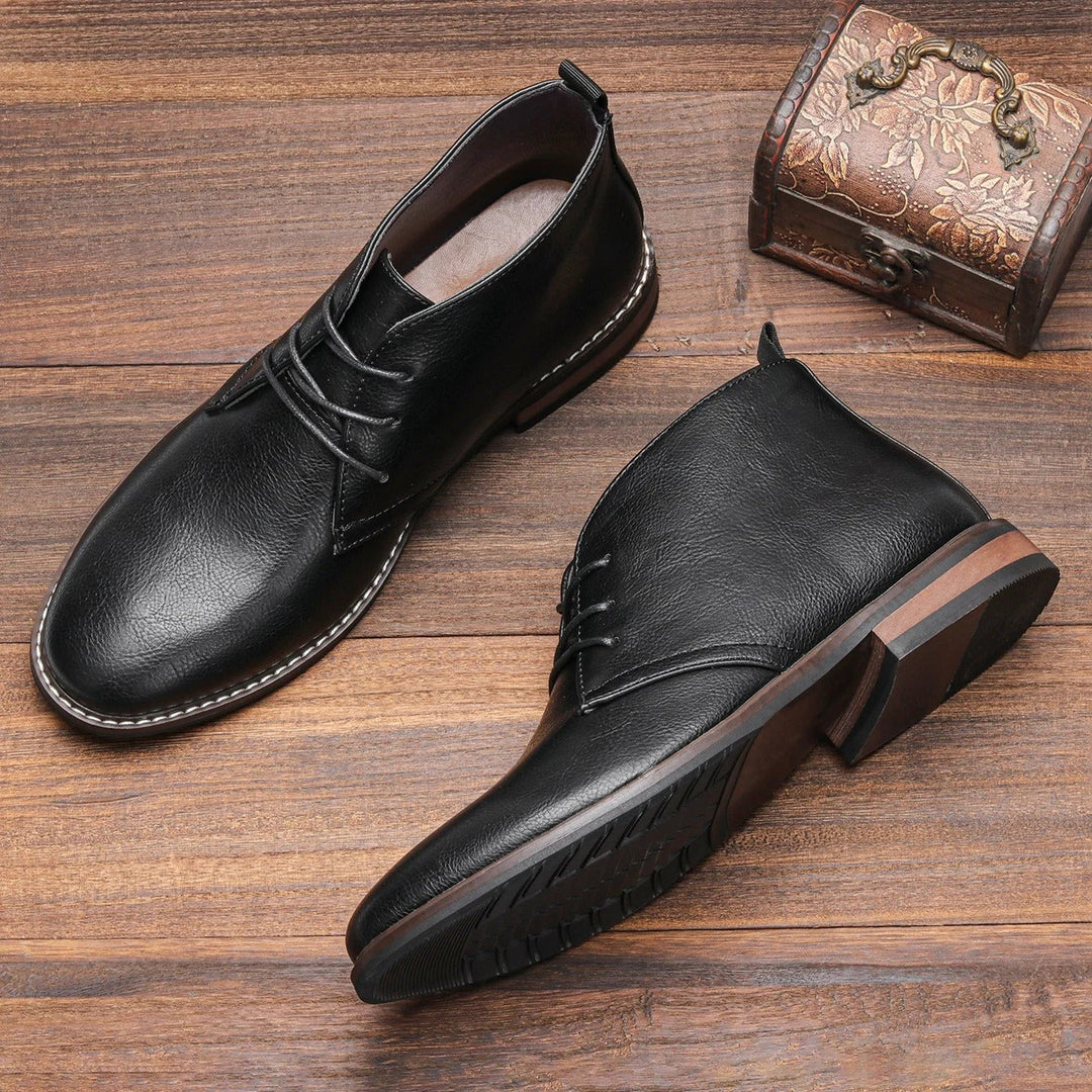 Modern men's black chukka boots, classic style with durable grip sole for all-day comfort and stability.