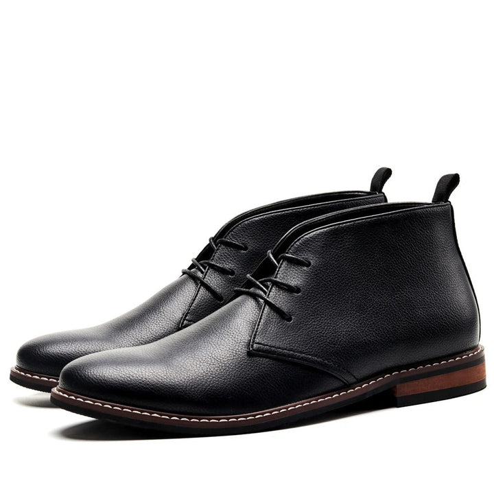 Comfortable men's black chukka boots, classic design, grip sole. Versatile casual or dress men's footwear option.