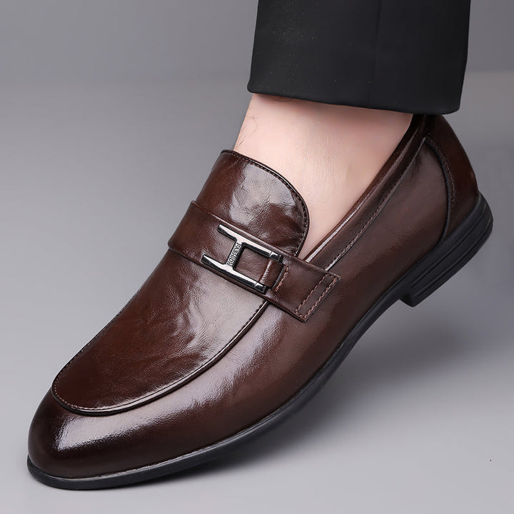 Sleek men's brown lace-up dress shoes, perfect for office environments and modern sophisticated professional wear.