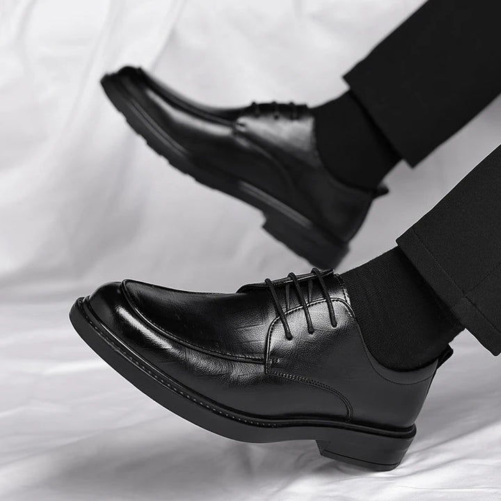 Elegant brown leather lace-up dress shoes for men, perfect for professional attire & sophisticated style.