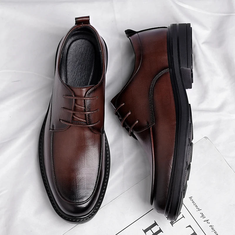 Front view of sophisticated men's black lace-up dress shoes, perfect for office and professional wear.