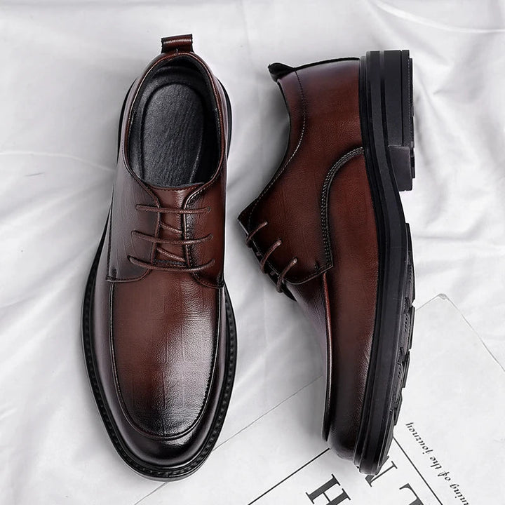 Front view of sophisticated men's black lace-up dress shoes, perfect for office and professional wear.