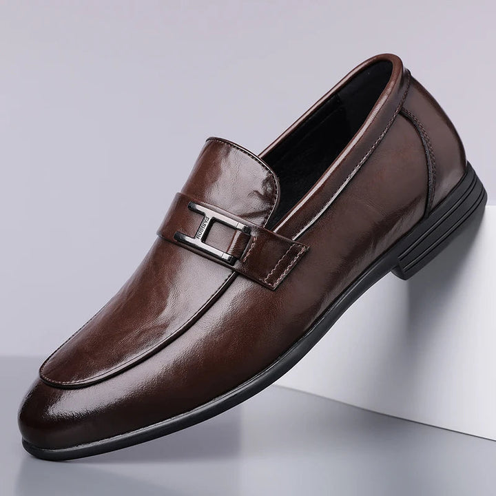 Rich brown leather texture on men's classic lace-up dress shoes, a sophisticated choice for formal occasions.