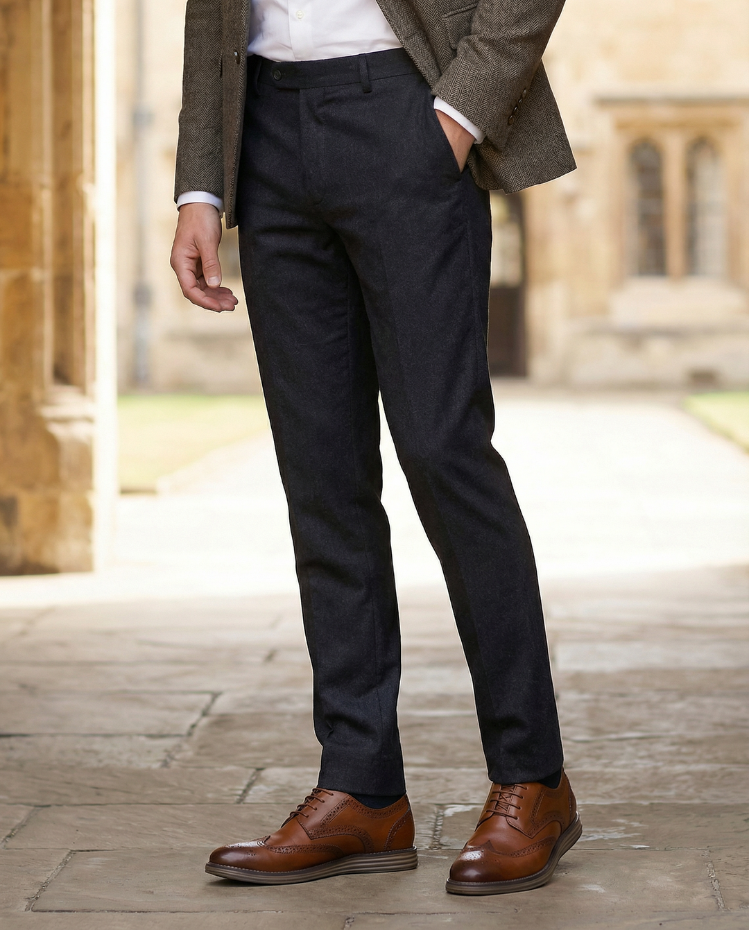 Polished leather Oxford dress shoes with intricate brogue detailing, designed for men's formal and professional attire.