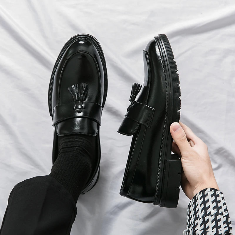 Men's classic black leather tassel loafers. Elegant slip-on dress shoes for formal & business occasions.