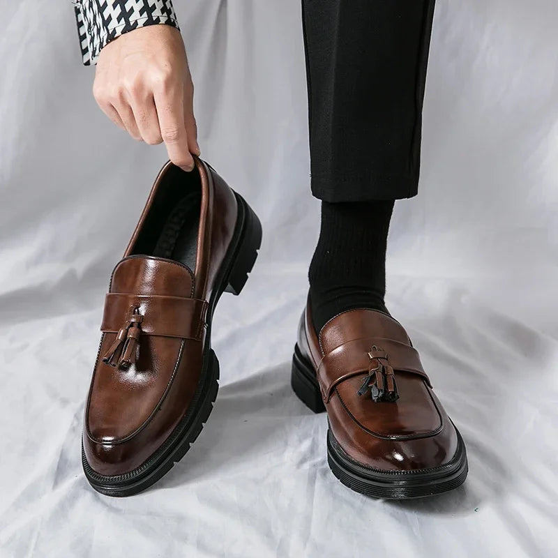 Men's classic brown leather tassel loafers, ideal dress shoes for a sophisticated business and formal look.