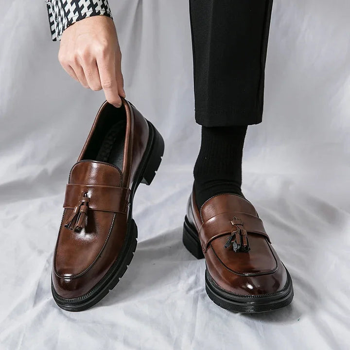 Men's classic brown leather tassel loafers, ideal dress shoes for a sophisticated business and formal look.