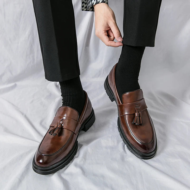 Premium brown leather men's tassel loafers. Classic, elegant slip-on dress & smart casual shoes.