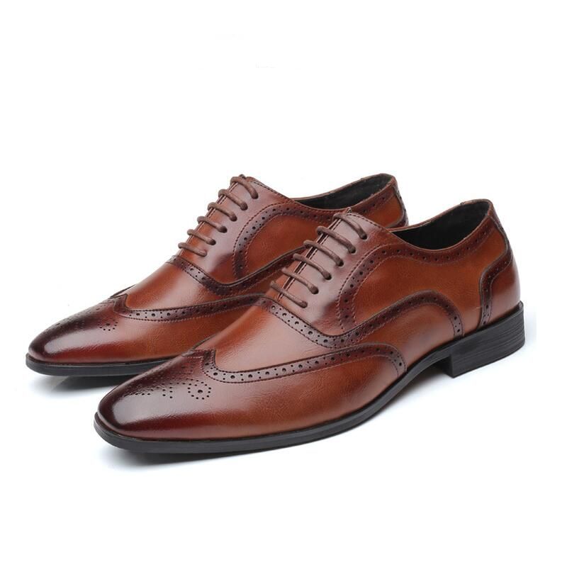 Men's black Oxford brogue dress shoes with durable leather and classic lace-up construction.