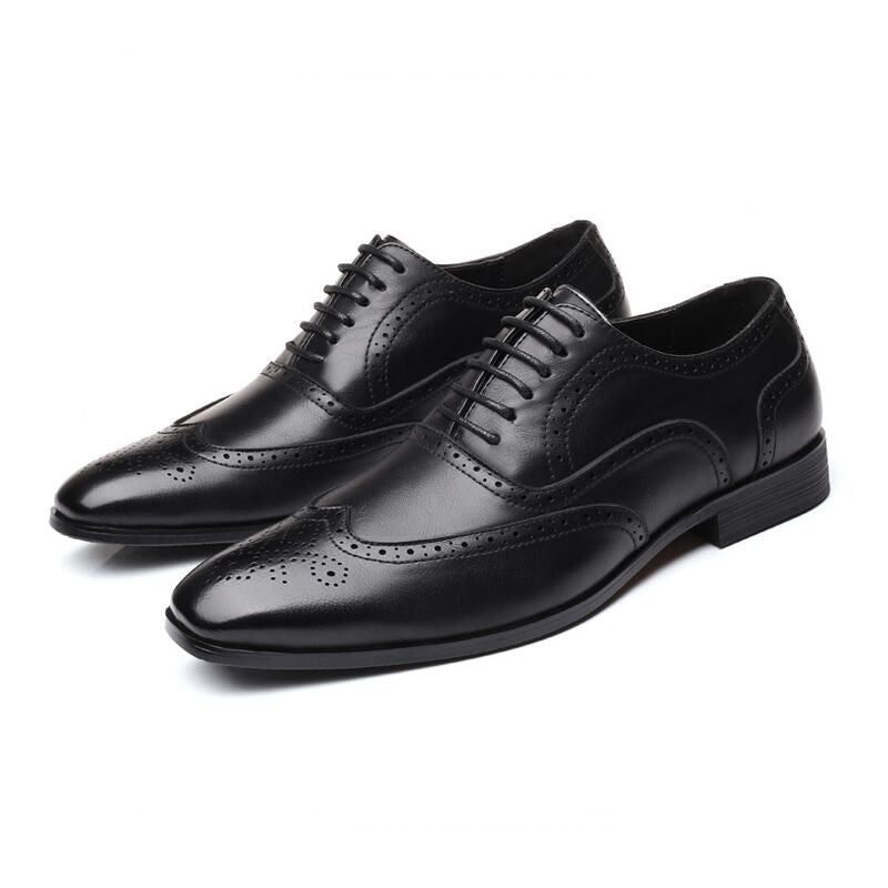 Timeless men's black Oxford brogue dress shoes, essential for any distinguished wardrobe.