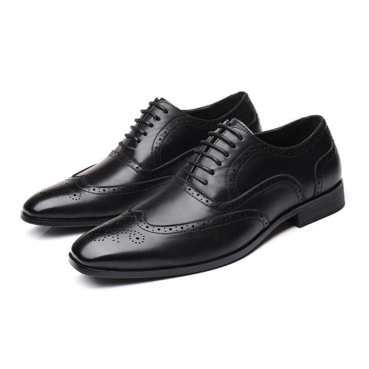 Timeless men's black Oxford brogue dress shoes, essential for any distinguished wardrobe.