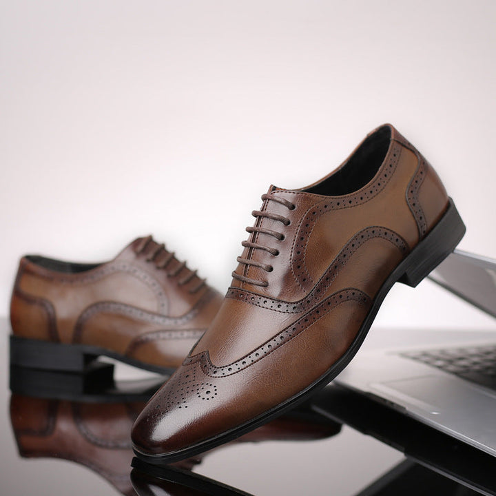 Men's classic black lace-up Oxford brogue shoes, showcasing fine craftsmanship & sleek design.