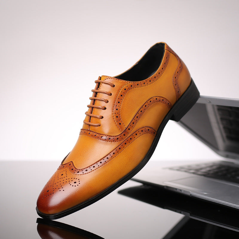 Stylish men's brown Oxford brogue dress shoes with detailed perforations for a refined look.