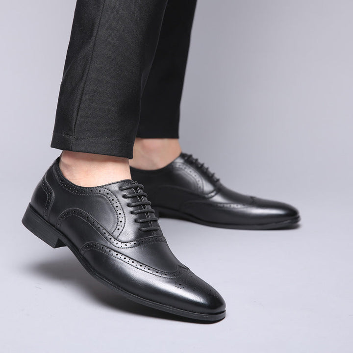 Refined men's black Oxford brogue shoes, designed for office wear & elegant occasions.