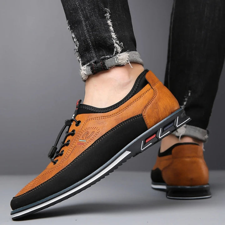 Men's classic black Oxford dress shoes, perfect for formal occasions & business wear. Timeless lace-up style.