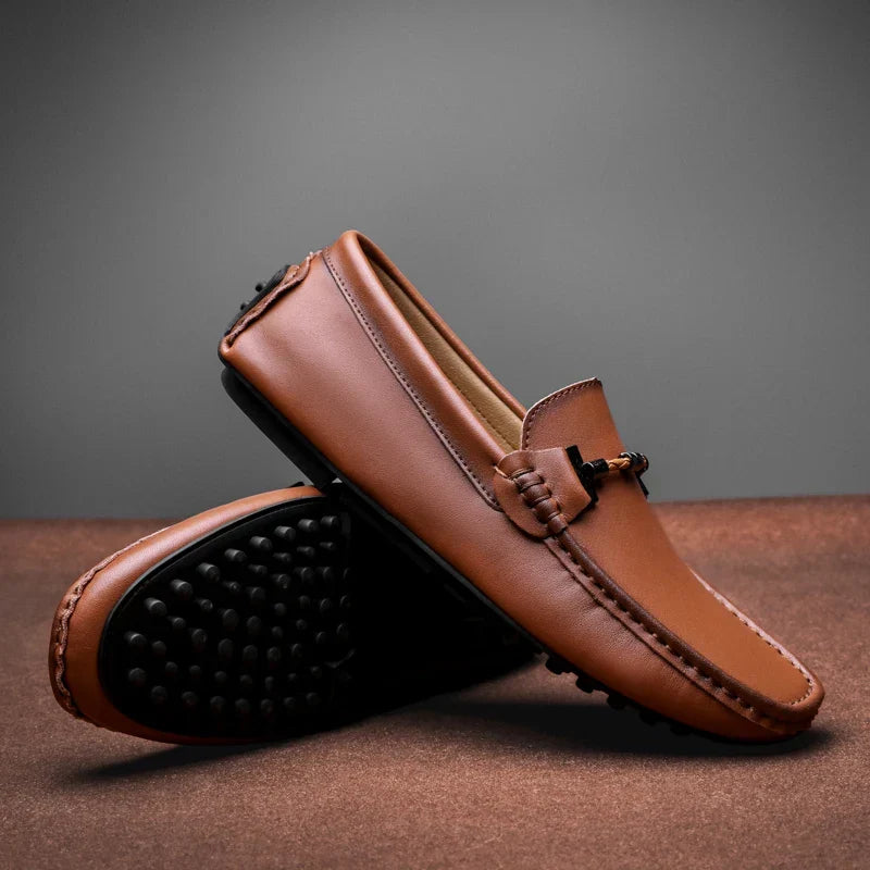 Men's classic black slip-on loafers, offering comfortable everyday wear and a versatile, durable style.
