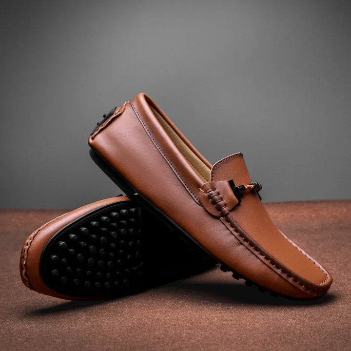 Men's classic black slip-on loafers, offering comfortable everyday wear and a versatile, durable style.