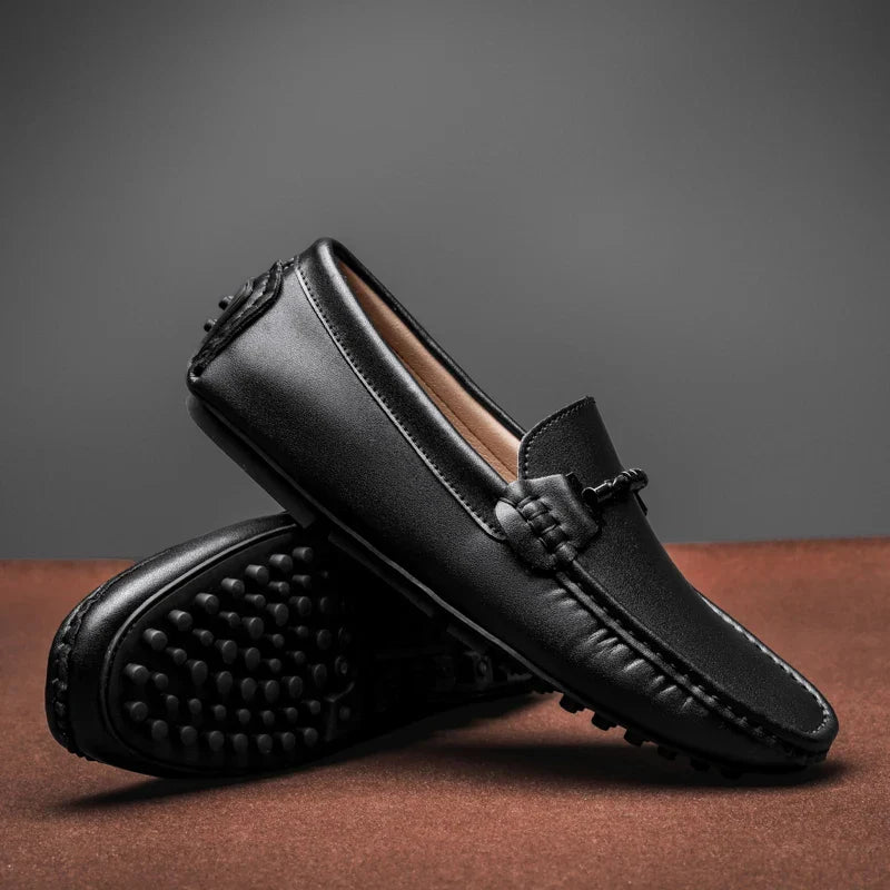 Stylish men's durable slip-on loafers in black, ideal for both casual comfort and formal occasions.