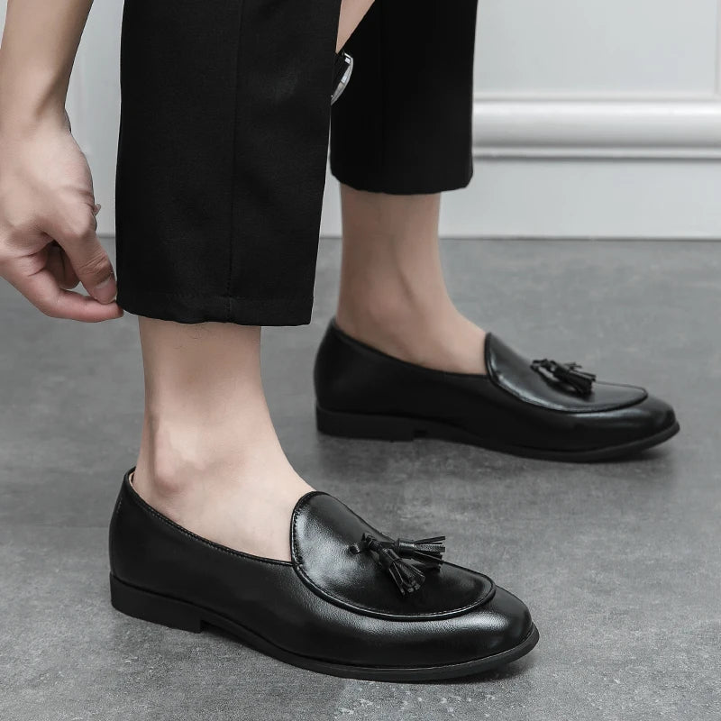 Brown suede men's tassel loafers, offering sophisticated comfort for smart casual outfits.