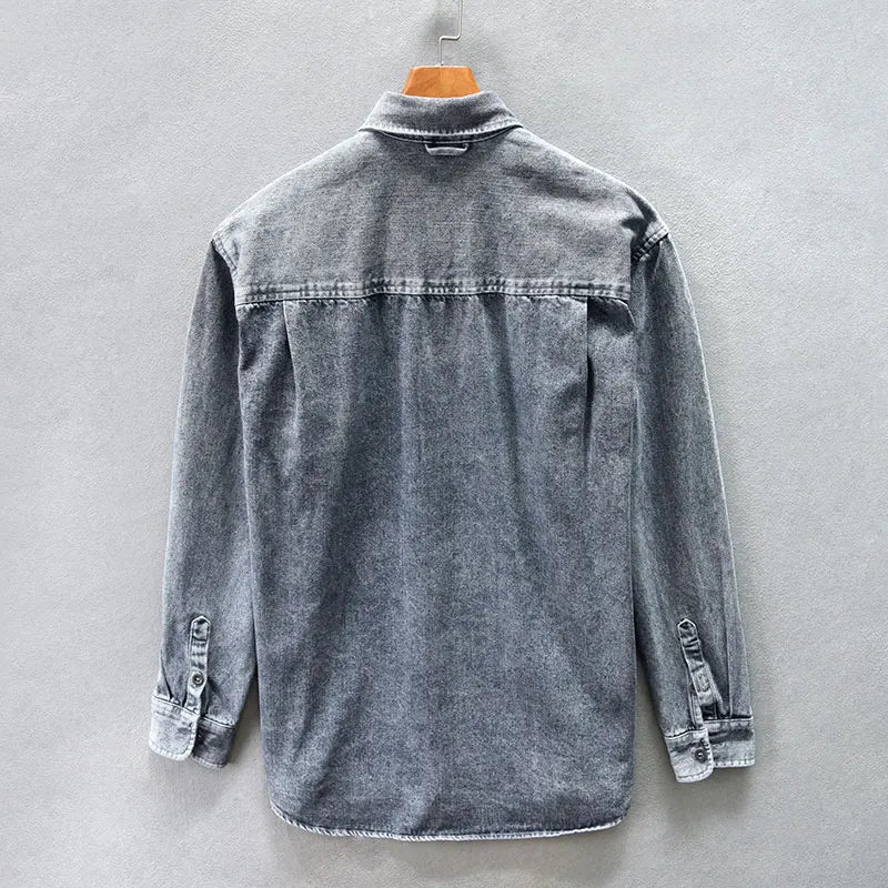 Versatile men's denim shirt in a classic wash, long sleeve button-up, offering timeless style & comfort.